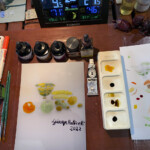 il piano di lavoro per l'elaborazione post produzione, Ecoline, colori, tavalozza, pennarelli e stampa a destra per le prove